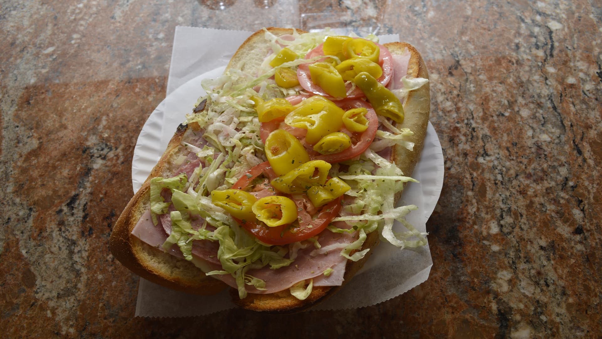 Delicious Italian hero with spicy peppers